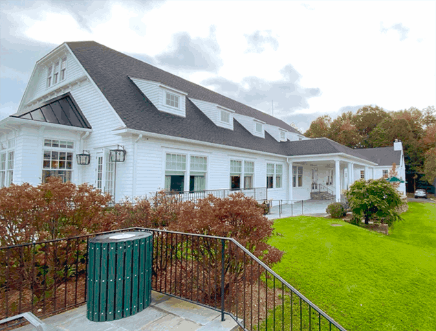 Professional gutter repair team working on Connecticut home